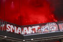 FC Twente-fans met een pyro in het uitvak van PSV