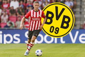 Joey Veerman voor het logo van Borussia Dortmund