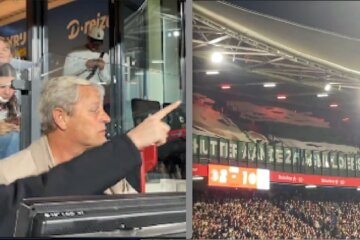 Peter Houtman kijkt naar het spandoek van de fans van FC Groningen